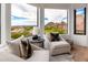 Cozy sitting area with plush chairs offering stunning views of the surrounding landscape at 24350 N Whispering Ridge Way # 22, Scottsdale, AZ 85255