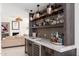 Beautiful wet bar with barstool seating and designer finishes at 24350 N Whispering Ridge Way # 22, Scottsdale, AZ 85255