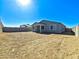 Spacious dirt backyard with block fence, offering a blank canvas for creating your dream outdoor living space at 24552 W Hilton Ave, Buckeye, AZ 85326