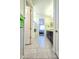 Well-lit bathroom with double sinks and a clear view of a walk-in shower and Primary bedroom at 24552 W Hilton Ave, Buckeye, AZ 85326