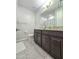 Bathroom vanity with granite countertops and ample storage at 24552 W Hilton Ave, Buckeye, AZ 85326