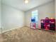 Bright bedroom space with neutral walls, carpeted floors, and playful furniture accents at 24552 W Hilton Ave, Buckeye, AZ 85326