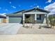 Inviting single-Gathering home featuring a two-car garage, desert landscaping, and a well-maintained lawn at 24552 W Hilton Ave, Buckeye, AZ 85326