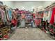 Spacious walk-in closet with ample storage, shelving, and organization for clothes, shoes, and accessories at 24552 W Hilton Ave, Buckeye, AZ 85326