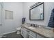 Updated bathroom with granite countertops, modern fixtures, decorative backsplash and tile floors at 2889 S 161St Dr, Goodyear, AZ 85338