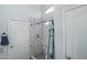 Stylish bathroom showcasing a tiled shower with glass door and updated fixtures at 2889 S 161St Dr, Goodyear, AZ 85338