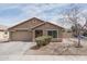 Charming single-Gathering home featuring a two-car garage and low-maintenance front yard landscaping at 2889 S 161St Dr, Goodyear, AZ 85338