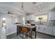 Open kitchen design with white cabinets, granite countertops, stainless steel appliances, and island seating at 2889 S 161St Dr, Goodyear, AZ 85338