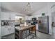 Bright kitchen with white cabinets, granite countertops, stainless steel appliances, and a central island at 2889 S 161St Dr, Goodyear, AZ 85338