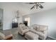 Inviting living room featuring neutral furniture, tiled floors, ceiling fan, and natural light at 2889 S 161St Dr, Goodyear, AZ 85338