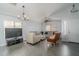 Bright living room with tile floors, neutral walls, and comfortable seating arrangement at 2889 S 161St Dr, Goodyear, AZ 85338