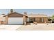 Attractive single-Gathering home with a two-car garage, front yard fence, and desert landscaping at 3147 W Phelps Rd, Phoenix, AZ 85053