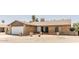 Charming single story brick home featuring a well-manicured front yard with desert landscaping and a two car garage at 3147 W Phelps Rd, Phoenix, AZ 85053