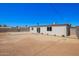 Large backyard featuring dirt, gravel, and block fencing at 3249 E Nisbet Rd, Phoenix, AZ 85032