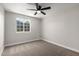 Bedroom with carpeted floor, ceiling fan, and window at 3249 E Nisbet Rd, Phoenix, AZ 85032
