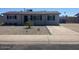 Charming single-story home featuring desert landscaping, a long driveway, and a welcoming front entrance at 3249 E Nisbet Rd, Phoenix, AZ 85032