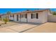 Single-story home with desert landscaping, a concrete driveway with a brick trim, and a covered entryway at 3249 E Nisbet Rd, Phoenix, AZ 85032