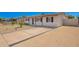 Beautiful single-story home with desert landscaping, a concrete driveway with a brick trim, and a covered entryway at 3249 E Nisbet Rd, Phoenix, AZ 85032