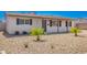 Well-maintained single-story home featuring desert landscaping, and an inviting covered entryway at 3249 E Nisbet Rd, Phoenix, AZ 85032
