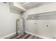 The laundry room contains a utility sink and hot water heater at 3249 E Nisbet Rd, Phoenix, AZ 85032