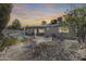 Private backyard featuring a pool, patio, and mature trees, creating a relaxing outdoor space at 3325 N Desoto St, Chandler, AZ 85224