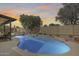 Backyard pool surrounded by lush landscaping, patio area, and privacy fencing at 3325 N Desoto St, Chandler, AZ 85224