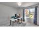 Home office featuring a white table and a window that brightens up the workspace at 3325 N Desoto St, Chandler, AZ 85224