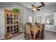 A spacious dining room with wood table and chairs, lit by a modern ceiling fan at 3325 N Desoto St, Chandler, AZ 85224