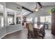 Open-concept dining room featuring wood floors, vaulted ceiling, and a kitchen view at 3325 N Desoto St, Chandler, AZ 85224