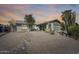 Inviting home with well-kept landscaping, decorative rocks and a charming front entrance at 3325 N Desoto St, Chandler, AZ 85224