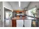 Updated kitchen with stainless steel appliances, cherry-colored countertops, and bright lighting at 3325 N Desoto St, Chandler, AZ 85224