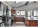 Bright kitchen features stainless steel appliances, and granite countertops, with natural light at 3325 N Desoto St, Chandler, AZ 85224