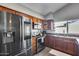 Updated kitchen features stainless steel appliances and natural lighting from a large window at 3325 N Desoto St, Chandler, AZ 85224