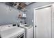 Well-organized laundry room with modern appliances and shelving for efficient storage at 3325 N Desoto St, Chandler, AZ 85224