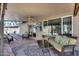 Inviting outdoor patio with comfortable seating, a ceiling fan, and views of the backyard at 3325 N Desoto St, Chandler, AZ 85224