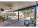 Comfortable outdoor patio with a ceiling fan, covered seating area, and access to the backyard at 3325 N Desoto St, Chandler, AZ 85224