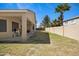 Spacious backyard with a covered patio, BBQ and mature landscaping at 3336 E Thornton Ave, Gilbert, AZ 85297