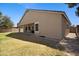 View of the backyard with covered patio area and lush lawn at 3336 E Thornton Ave, Gilbert, AZ 85297