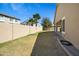 View of large backyard featuring a covered patio and block wall at 3336 E Thornton Ave, Gilbert, AZ 85297