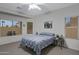 Bedroom with natural light, a ceiling fan, and a comfortable bed, creating a restful and inviting ambiance at 3336 E Thornton Ave, Gilbert, AZ 85297