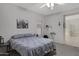 Bedroom featuring carpet, a ceiling fan, and neutral decor, creating a serene and inviting personal retreat at 3336 E Thornton Ave, Gilbert, AZ 85297