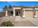 Inviting single-story home with a covered front porch and a two-car garage with desert landscaping at 3336 E Thornton Ave, Gilbert, AZ 85297