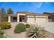 Well-maintained desert landscaping complements this single-story home with a two-car garage and covered porch at 3336 E Thornton Ave, Gilbert, AZ 85297