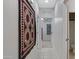 Hallway showcasing tile flooring and neutral walls, creating a seamless transition to the adjacent bedroom at 3336 E Thornton Ave, Gilbert, AZ 85297