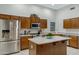 Well-equipped kitchen featuring stainless steel appliances, ample cabinet space, and a kitchen island at 3336 E Thornton Ave, Gilbert, AZ 85297
