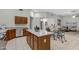 Open floorplan kitchen with stainless steel appliances, light colored countertops, and tile floors at 3336 E Thornton Ave, Gilbert, AZ 85297