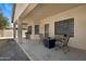 Covered patio area with outdoor seating and a fire pit at 3336 E Thornton Ave, Gilbert, AZ 85297