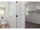 Clean, bright toilet and linen closet with an open doorway view to an upstairs bedroom at 3467 S Falcon Dr, Gilbert, AZ 85297