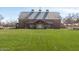 Large community center with barn-like architecture and a lush green lawn at 3467 S Falcon Dr, Gilbert, AZ 85297