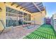 Cozy backyard patio with hammock, artificial turf and sliding door entry at 4342 E Ronald St, Gilbert, AZ 85295